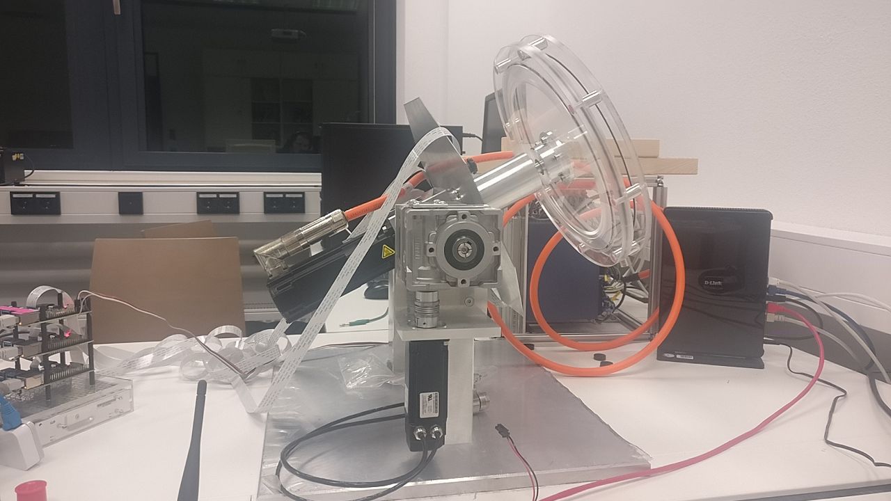 Picture of the ball and hoop setup, which shows  that the hoop can rotate in 2 axes